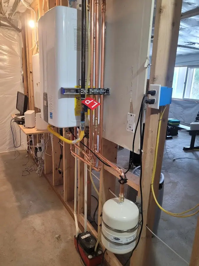 Licensed plumber repairing a kitchen sink in Sharon