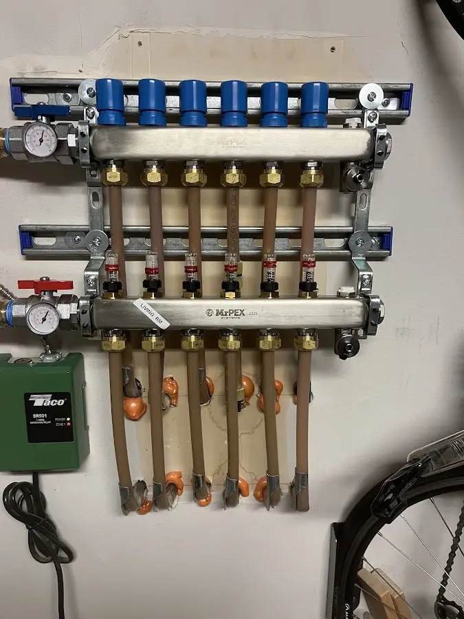 Plumber performing Water Heater Repair at a residential property in Sharon